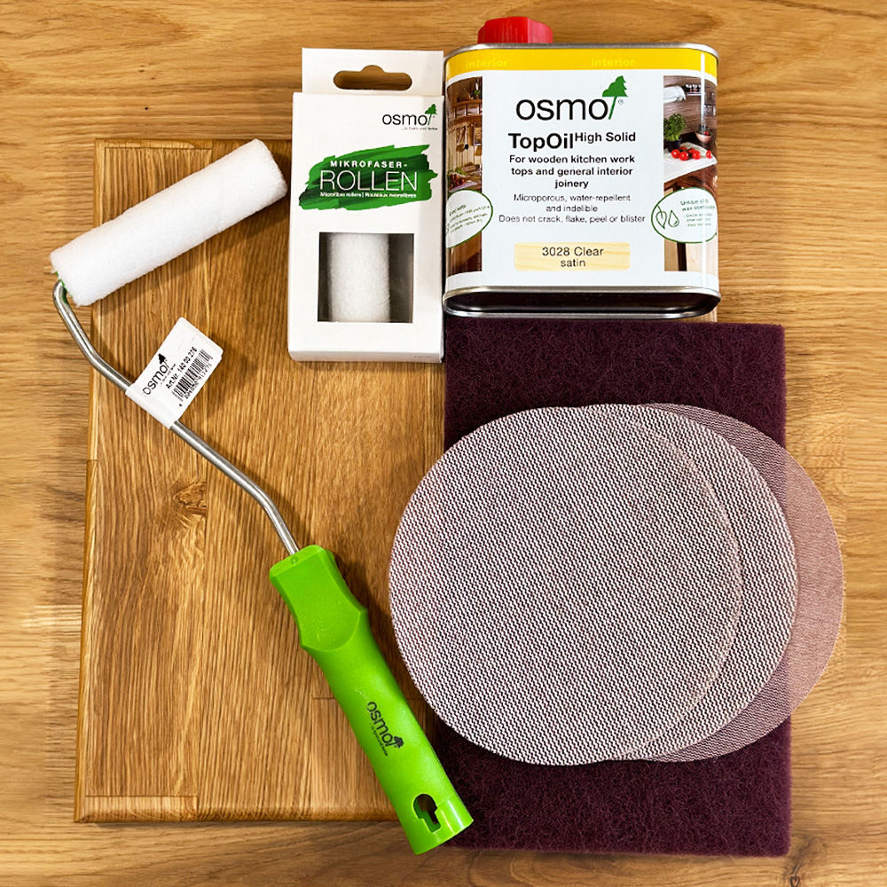 tools for oiling and sanding a wooden worktop